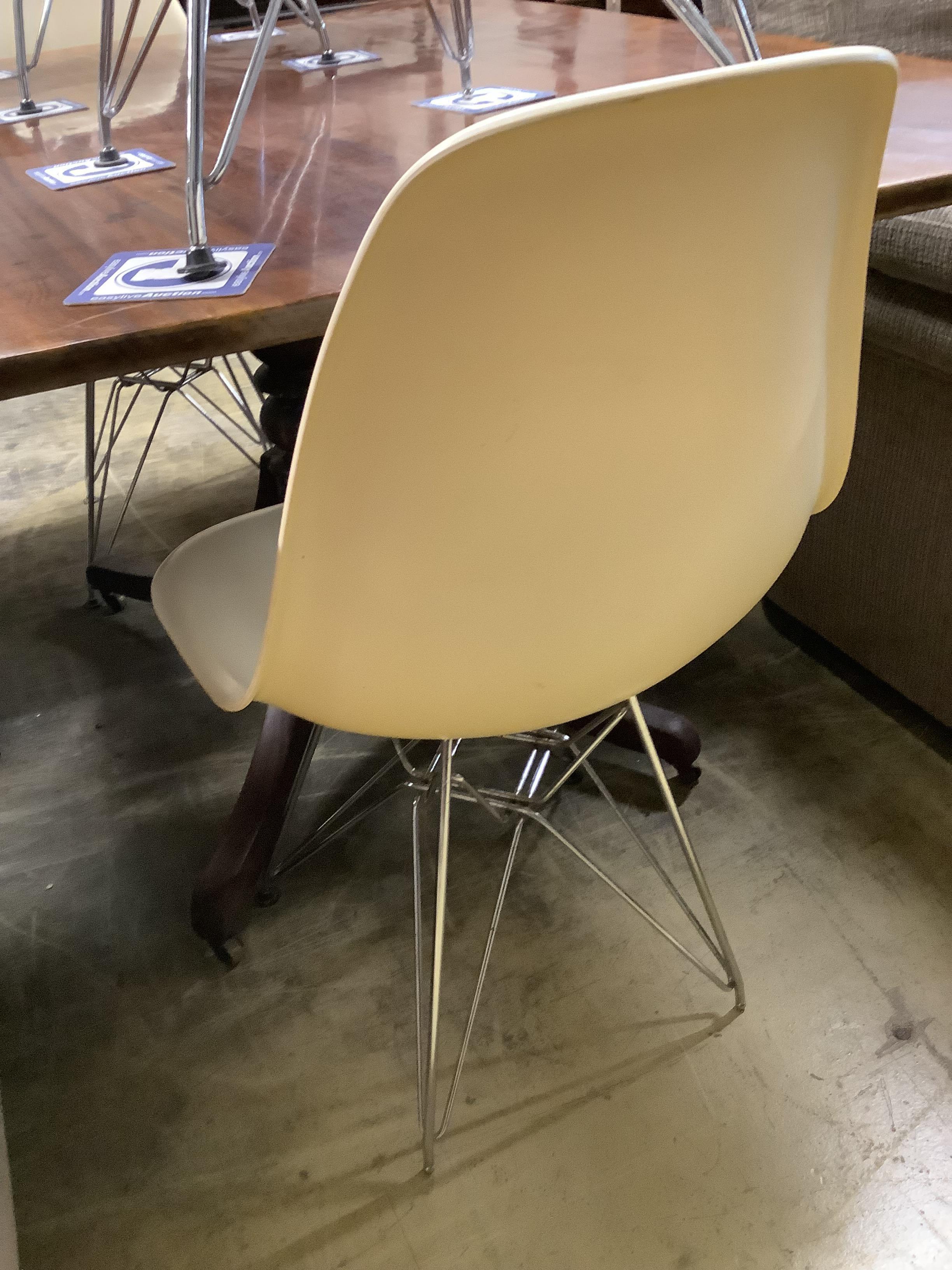 A set of four Eames fibre glass Eifel base chairs